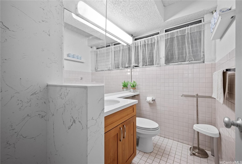 bathroom with walk in shower.