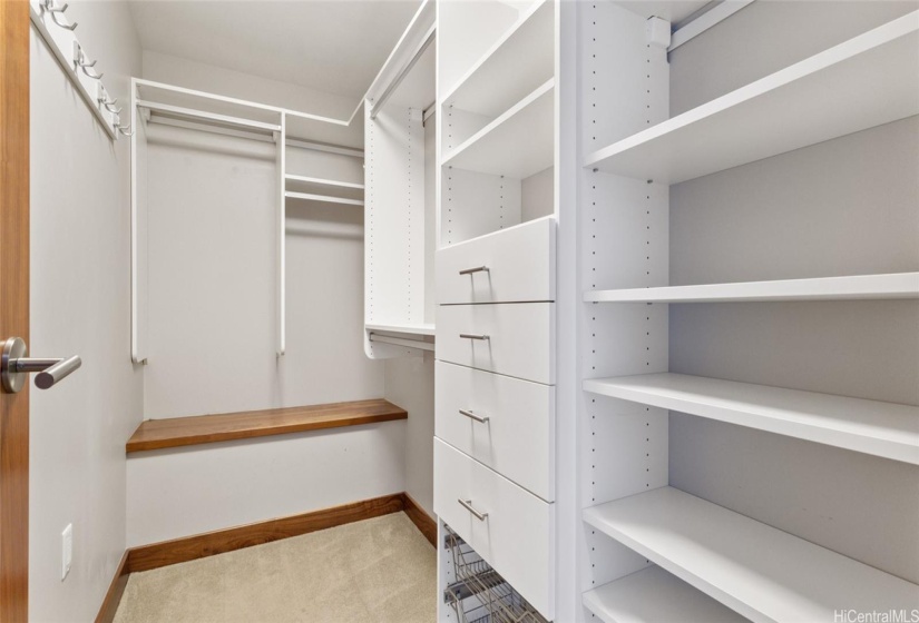 The large walk in closet has a custom closet system to keep your clothes organized.