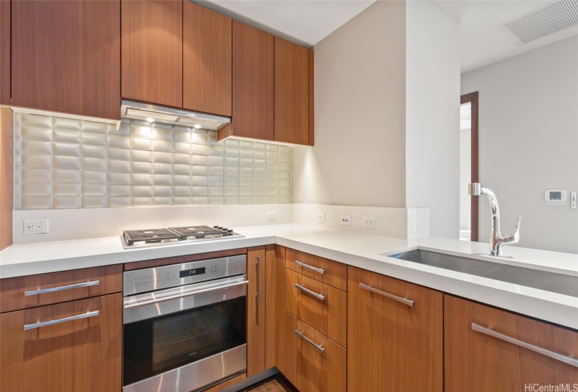 Surrounding the kitchen are numerous cabinets for storage and organizing.