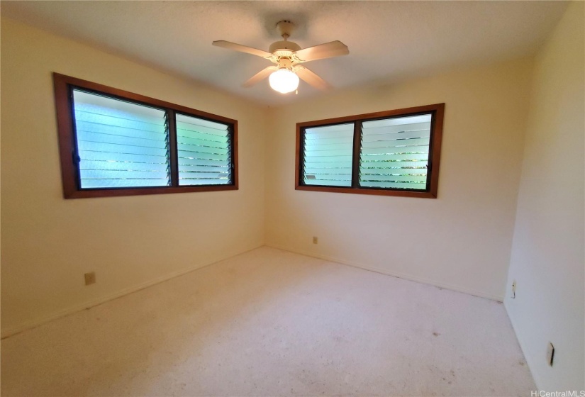 Third Bedroom with Ceiling Fan and Garden Views