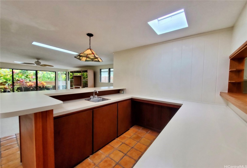 Wet Bar, Storage,  Skylight, and Stained Glass Pendant Light