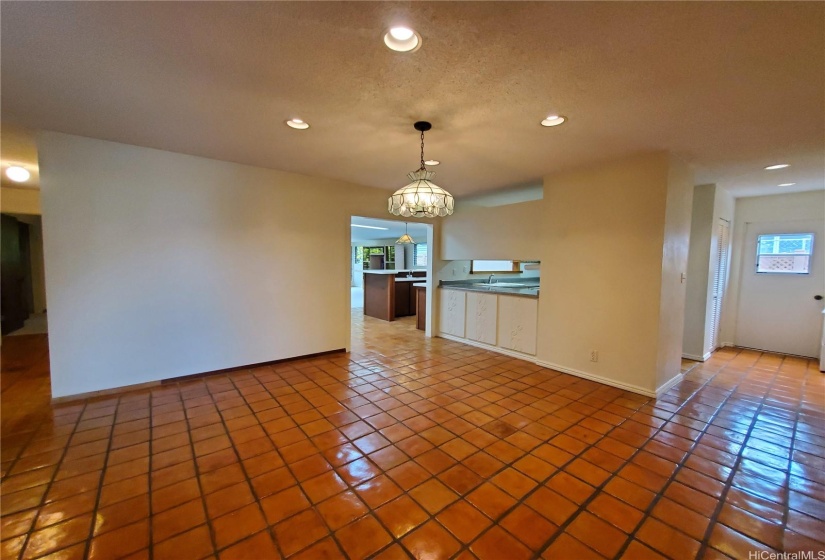 Foyer with Midcentury Modern Tile, Pendant Light, and Recessed Lighting