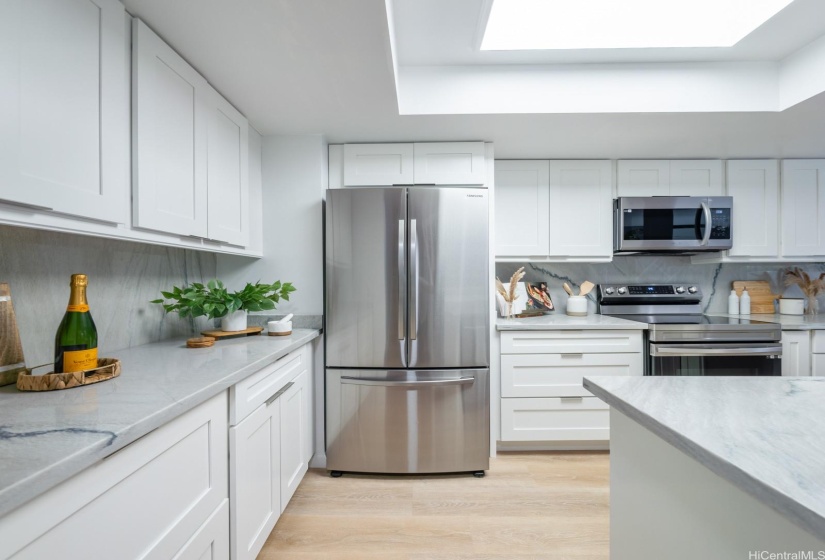 Kitchen with quartz countertops and stainless steel appliances