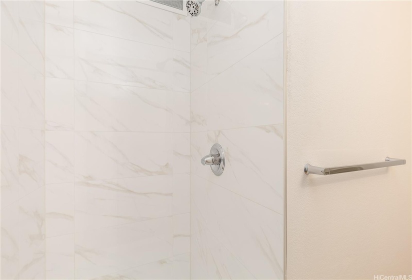 New shower tiles and hardwares at guest bathroom.