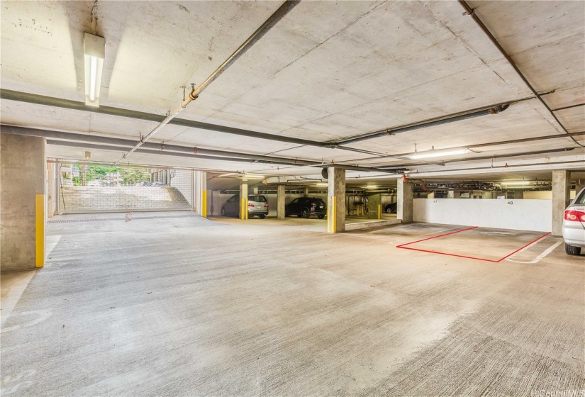 Covered parking #48, close to garage exit.