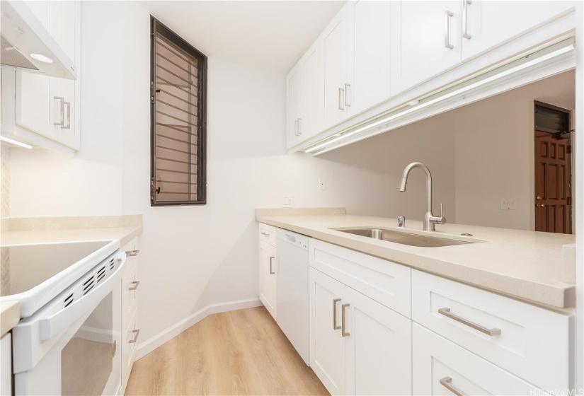 Kitchen window enhances ventilation.