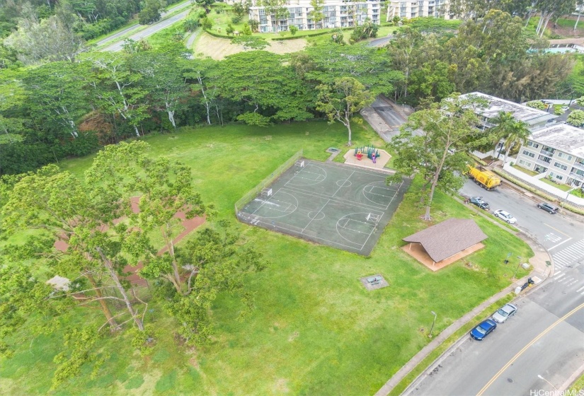 Overhead view of park across from building.