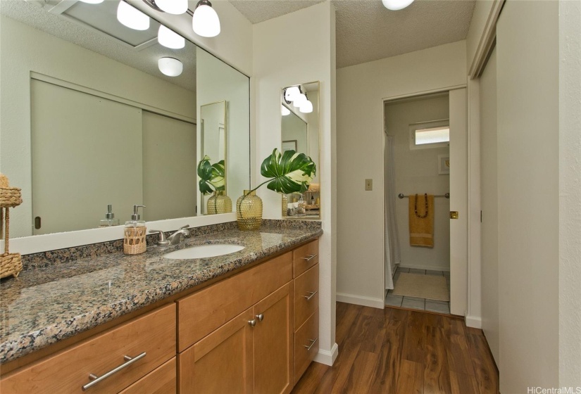 Primary vanity suite with two large closets and separate bath and lavatory.