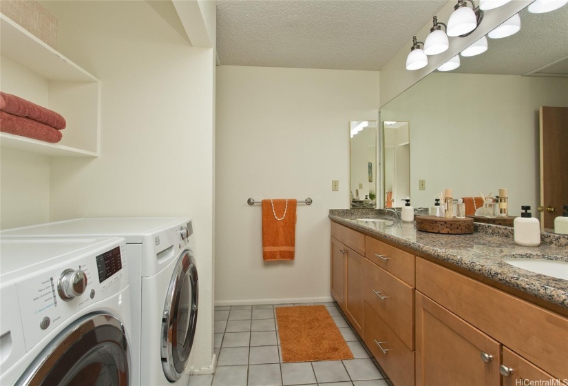 common oversized bathroom with dedicated laundry area