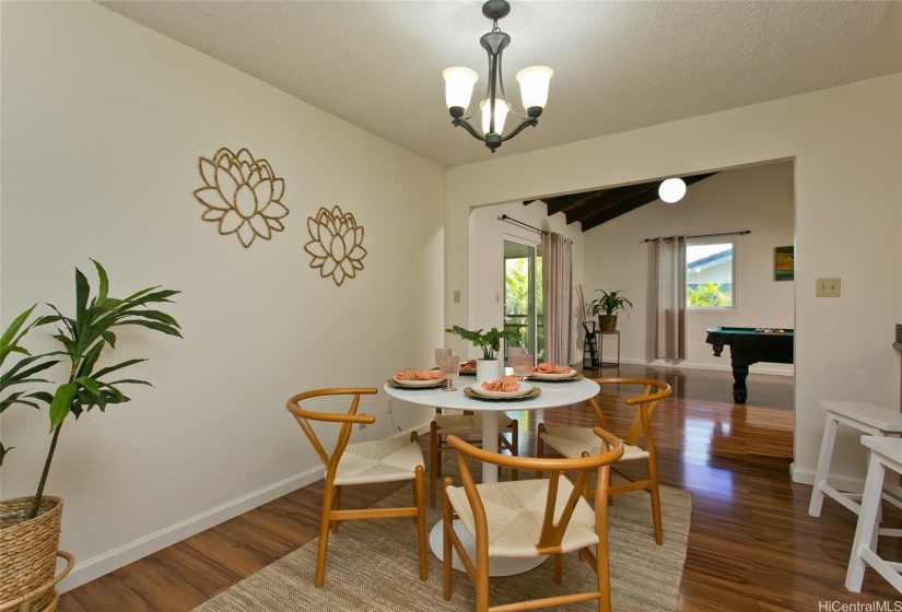 With a well thought out floorpan, there is terrific access throughout the home. Here you will see access to recreational living space and back lanai from dining.