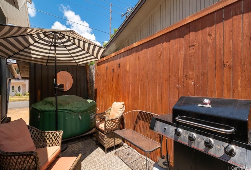 Yard space with room for BBQ, hot tub and additional storage.