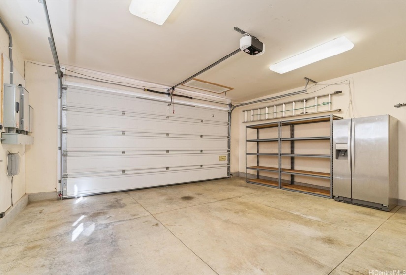 Spacious garage with extra fridge (and secret storage area!).