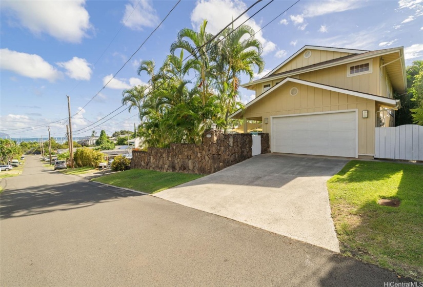 Roomy driveway with extra parking to the side.