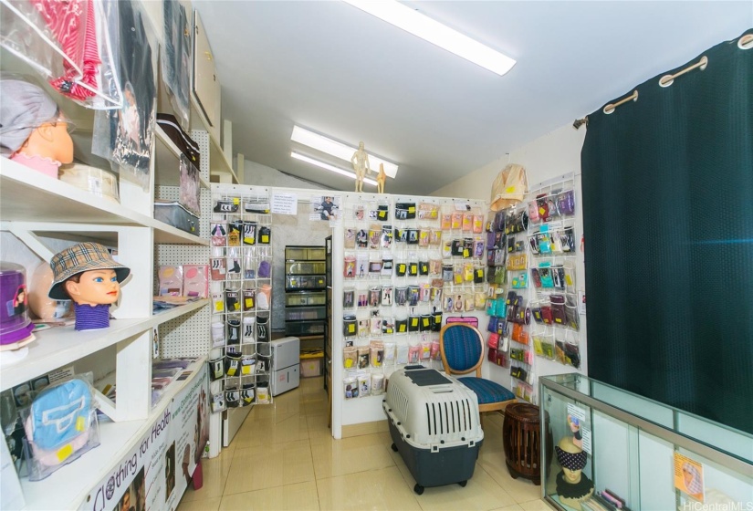 Finished storage room/workshop with natural lighting, high ceiling, and built-in shelves!