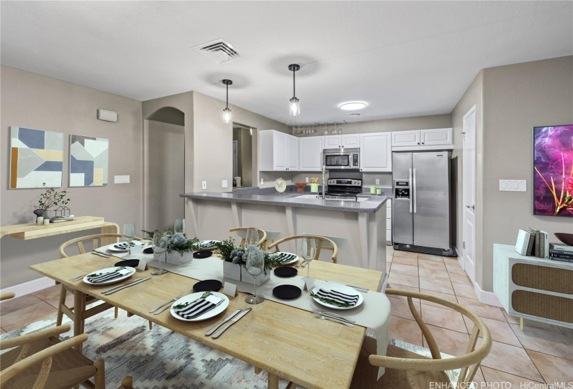 Stainless steel appliances, corian countertops, tiled floors.   Enhanced living room.