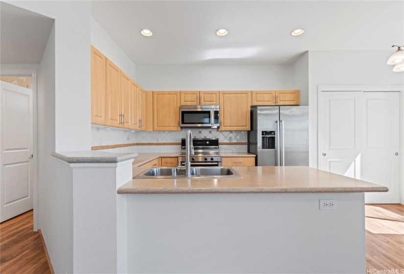 Kitchen features recessed lighting.