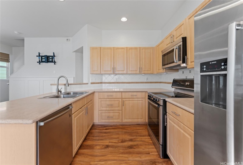 Kitchen has an open concept with modern appliances.