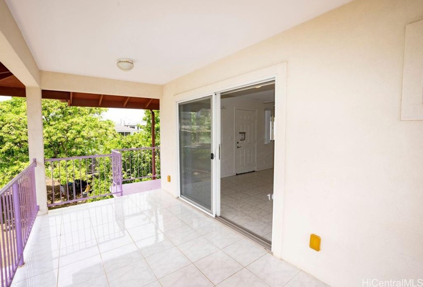 Upstairs covered deck with ceramic tile flooring.