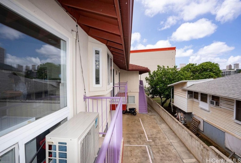 The upstairs living area has a split AC unit.