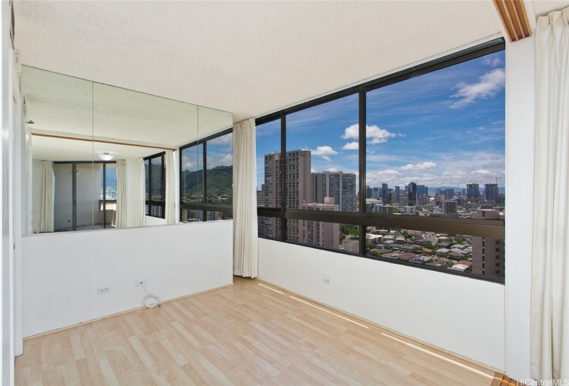 Second bedroom features a sliding door that provides the option to close the room or expand the living room area