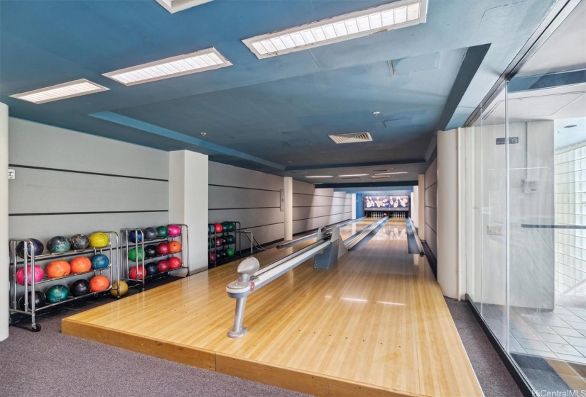 Bowling alley adjacent to recreation room.