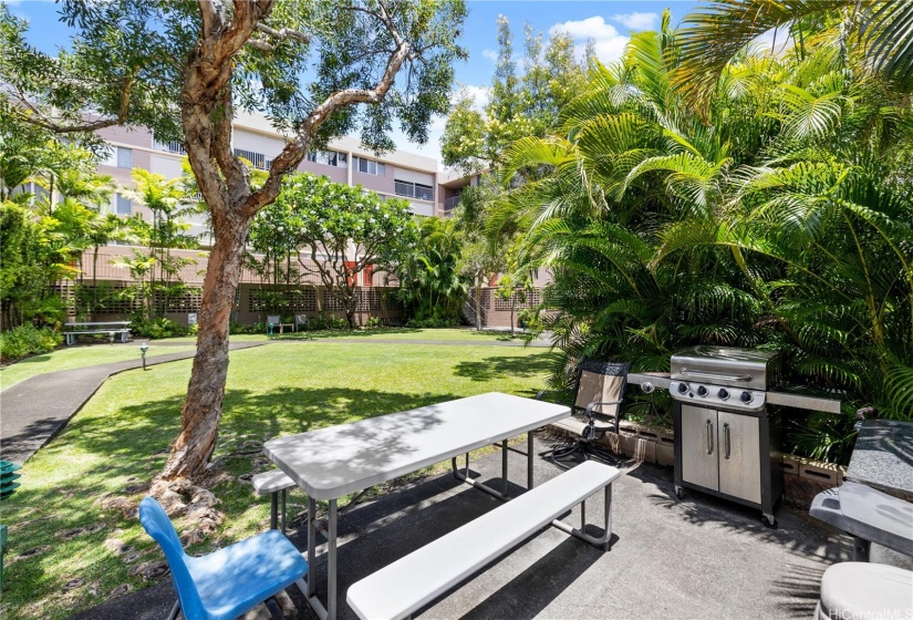 Enjoy outdoor dining and barbecues in the lush green courtyard.