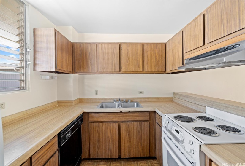 A charming kitchen with efficient storage and equipped with modern appliances.