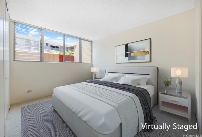 A serene bedroom with a minimalist design, allowing fresh air and natural light to flow in.