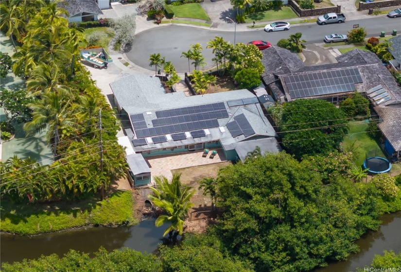 Home has 58 PV panels installed  in 2012 may be leased. some of the back yard is the Kawainui canal property that the owner maintains.