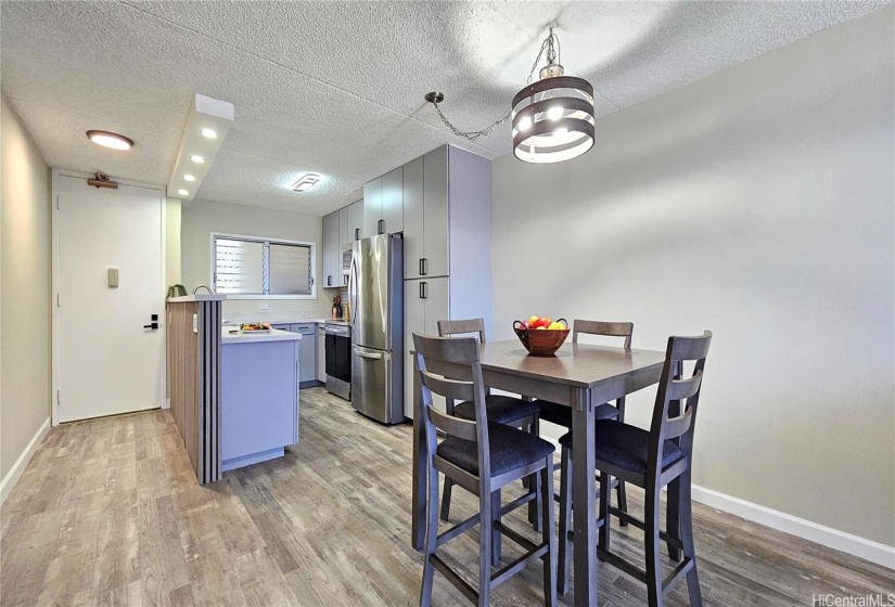 Open Kitchen with custom wood wall and new quartz countertop