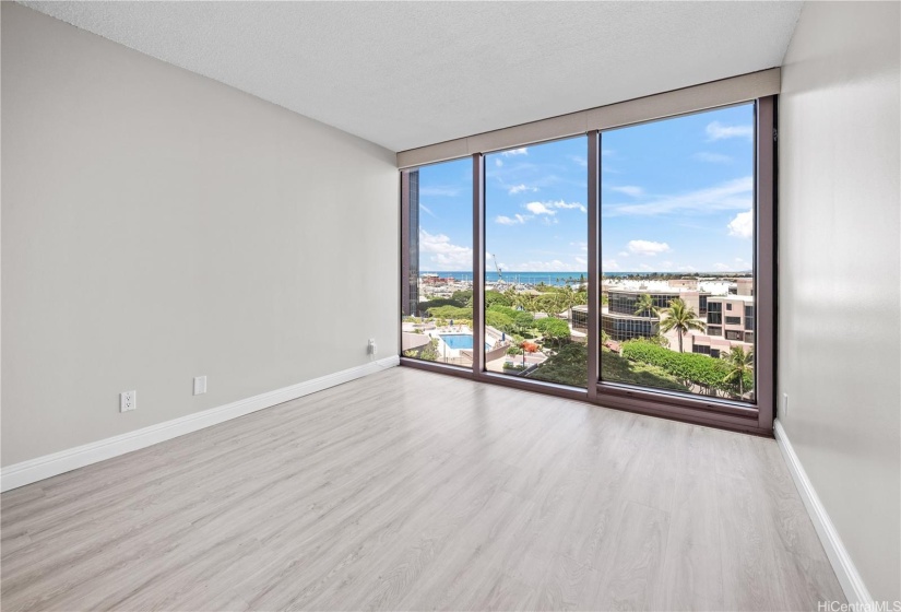 bedroom - actual with more views from the floor to ceiling windows with blinds.