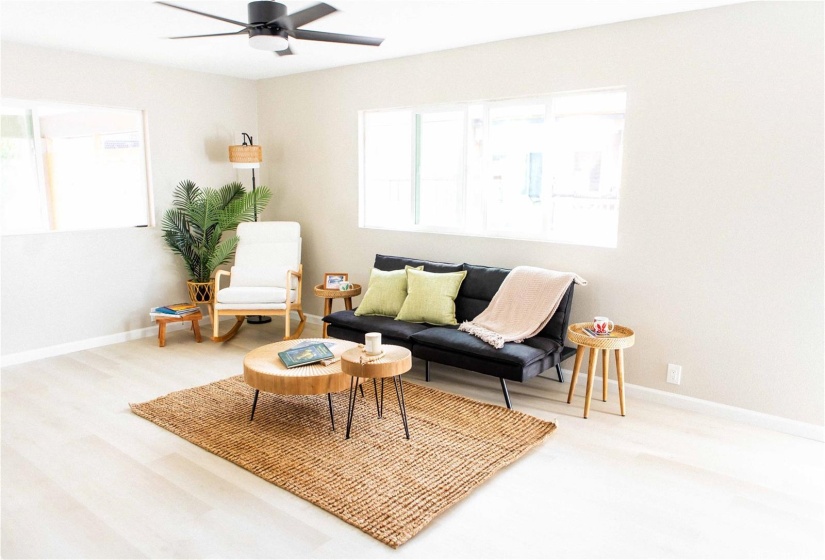 Natural Light Illuminates The Spacious Living Room.