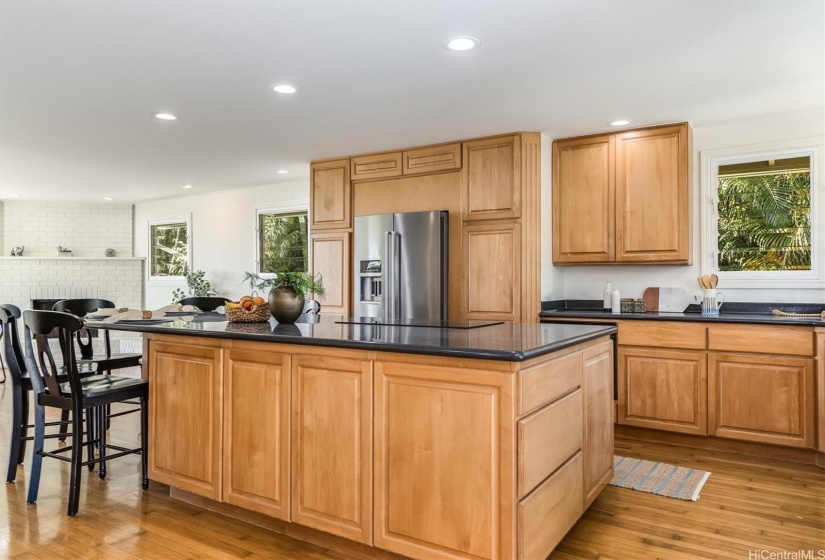 Large open kitchen with an expansive island and ample storage.