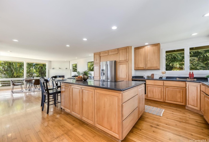 Dark counters, hardwood floors and recessed lighting creates a modern asthetic.