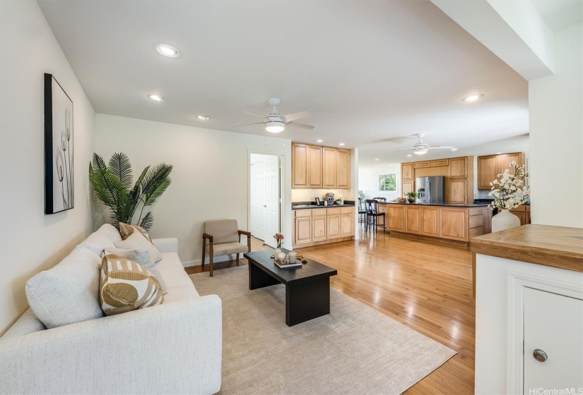 The open floor plan seemlessly connects the living, kitchen and dining areas.