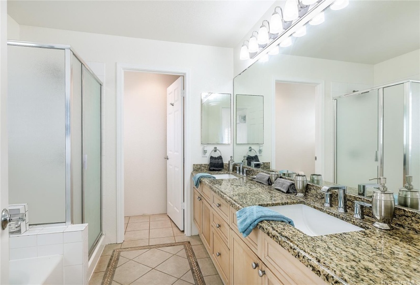 En Suite with Double Sinks, Storage, and Private Lavatory