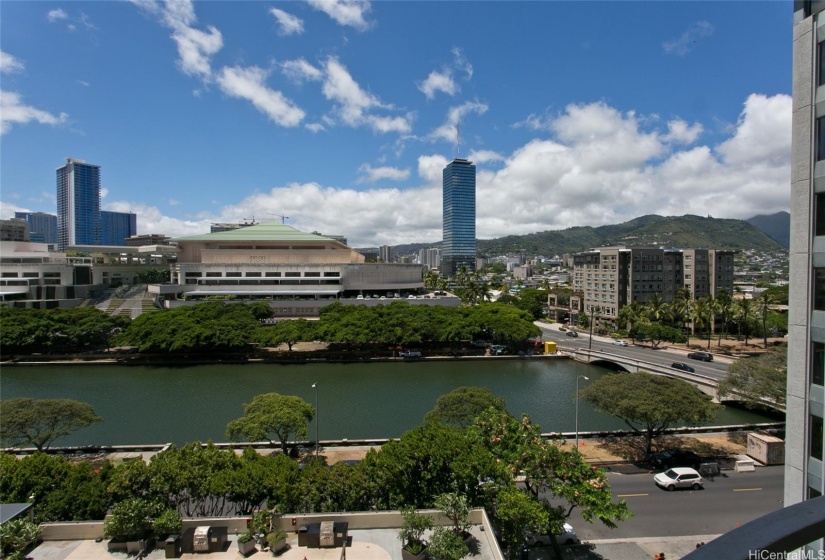 View from the unit of the Ala Wai Canal and BBQ grills on the amenity deck