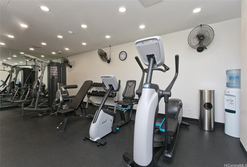 Fitness room with cardio machines, strength training and free weights