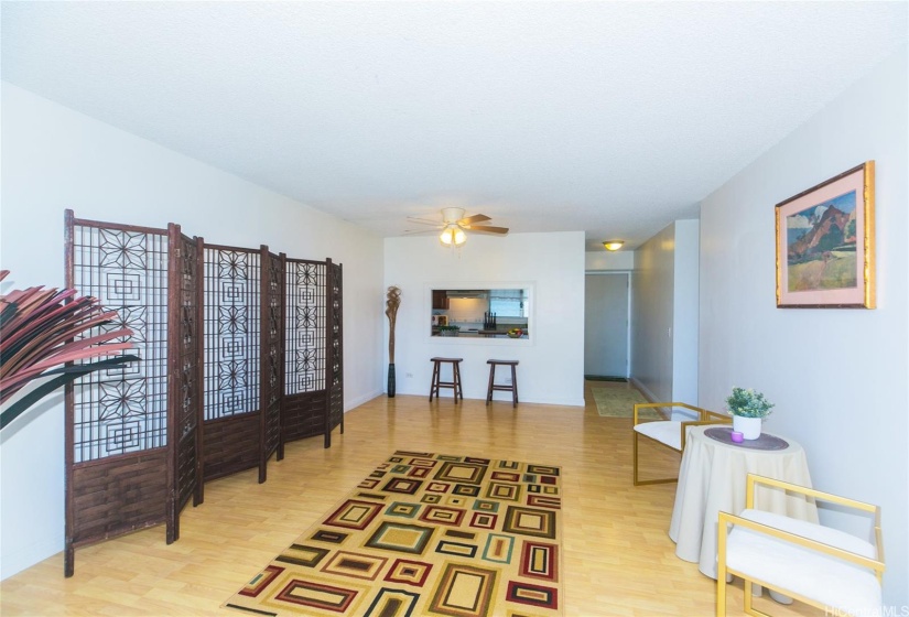 Living and Dining Areas looking towards Kitchen and Entry