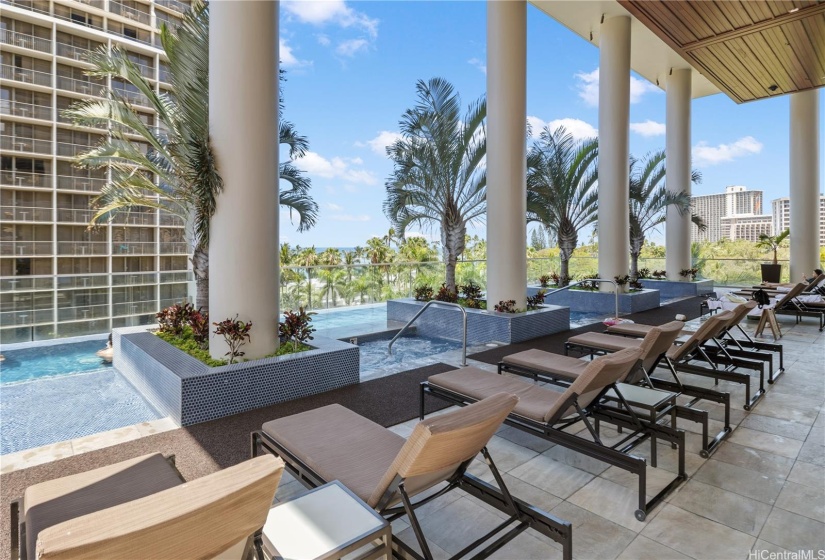 Pool area equipped with heated whirlpool