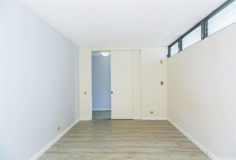 View of the bedroom towards hallway, vinyl plank flooring