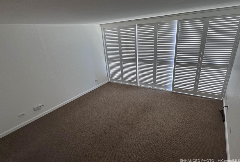 Living room with sliding door shades closed*Enhanced Photo