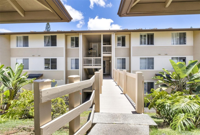 walkway view from parking area. Unit upstairs on on the left.