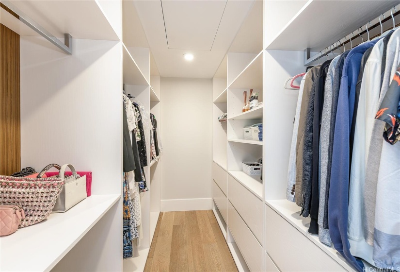 Primary bedroom walk in closet