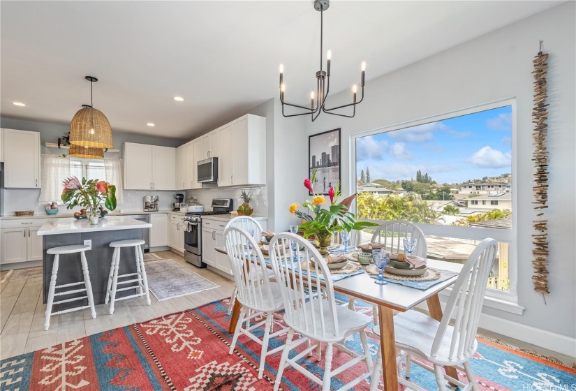 Open concept kitchen, dining area and living room.