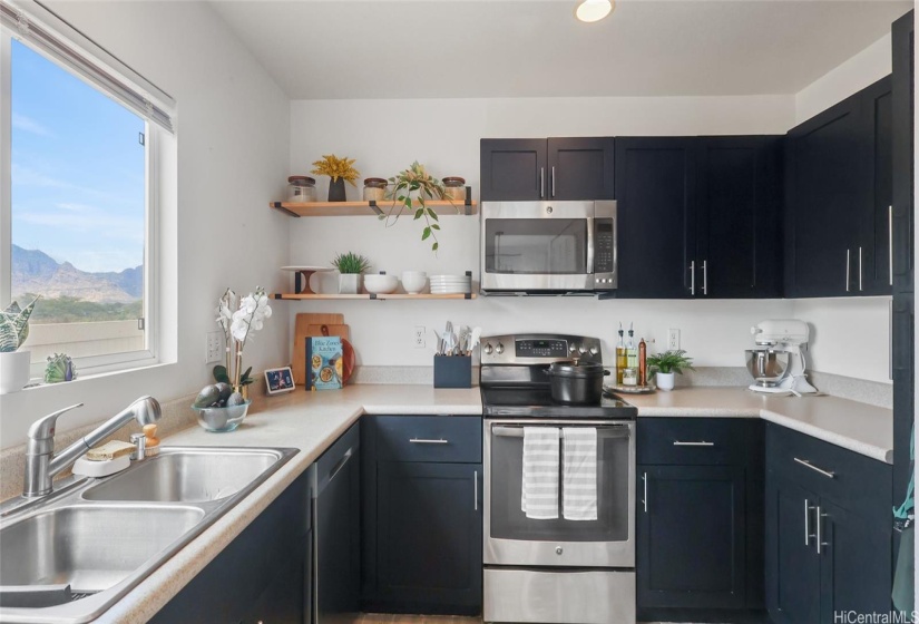 Open Shelves and cabinets offer a modern feel with lots of natural light