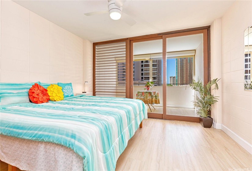 Primary bedroom over looking the enclosed lanai, with sliding doors and jealousies for cool breezes