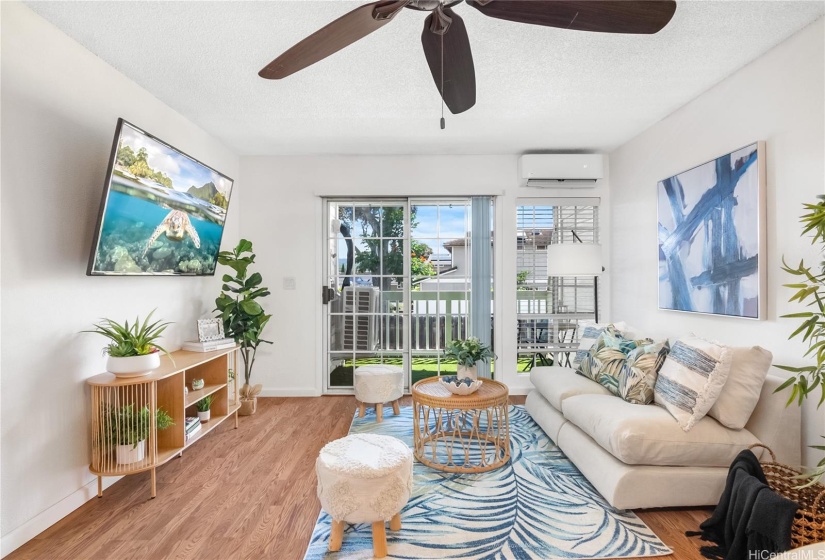 Living room with ceiling fan,  split AC and lanai access