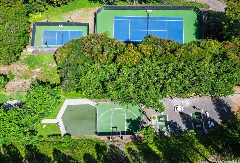 Arial view of the various exterior courts and activities like corn hole and a putting area