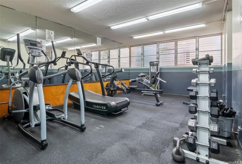 Workout room with running and lifting equipment